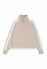 Felpa beige chiaro con colletto a mezza zip, strisce laterali bianche e polsini e orlo a costine. Tessuto morbido con una superficie liscia.