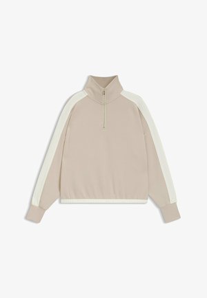 Ljusbeige sweatshirt med halvdragkedja, vita sidostrikar och ribbade ärmslut och nederkant. Mjuk tyg med en slät yta.