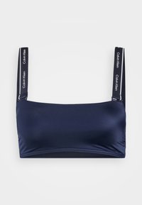 Mornarsko plava bralette s glatkom teksturom, uključujući široke naramenice s logotipom Calvin Klein i jednostavnim, minimalističkim dizajnom.