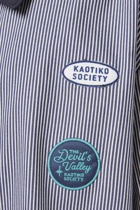 Navy and white striped fabric with two embroidered patches: "KAOTIKO SOCIETY" in blue and "THE Devil's Valley" in turquoise. Round and oval shapes.