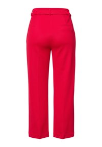 Red textured trousers with a straight leg, featuring a rear pocket and a fitted waistband. The fabric has a subtle pattern.