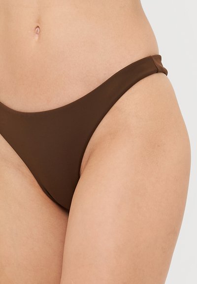 Brown bikini bottom with a smooth texture, low-rise cut, and minimalistic design. Features narrow side straps and seamless edges.