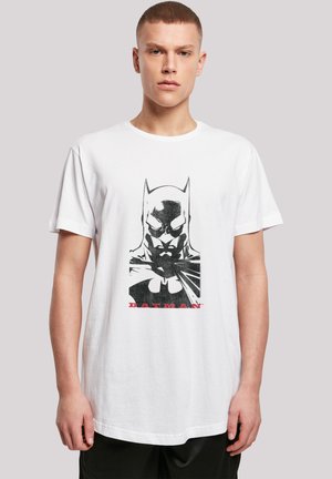 White cotton t-shirt featuring a black and grey graphic of a character's face and red text reading "BATMAN" below the graphic.