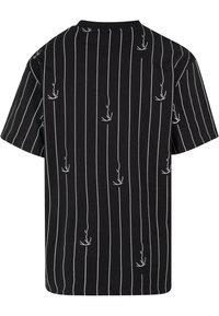 Black short-sleeve t-shirt with white vertical stripes and small floral patterns scattered throughout, featuring a crew neck and relaxed fit.