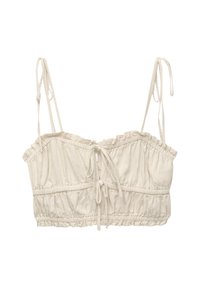 Lyhyt beige toppi, jossa on säädettävät olkaimet, kerrostettua yksityiskohtaa ja kiristysnauha edessä.