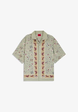 Beige kortærmet skjorte med knapper foran, dekoreret med vestlige temaer som cowboys, heste, hestesko og spillekort.