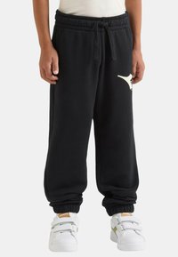 Pantaloni della tuta neri con vita elasticizzata e coulisse, con un logo bianco sulla coscia e polsini a coste alle caviglie.