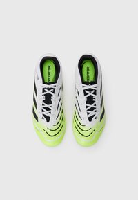 White and neon green soccer shoes with black stripes, textured upper, and contrasting inner lining, featuring a streamlined design and laces.