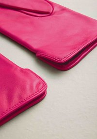 Bright pink leather gloves with smooth texture, curved edges, and stitched seams. The design features a finger slot opening for ease of wear.