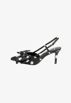 Černá lodička na vysokém podpatku se zavazováním za patu s bílými puntíky, velkou mašlí na špičce a nastavitelnou přezkou na kotníku.