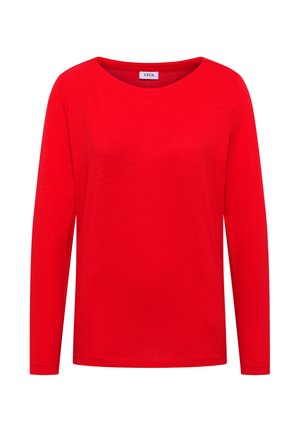 T-shirt rouge à manches longues en tissu doux, avec un col rond et une coupe décontractée. L'étiquette au niveau du col indique "CECIL."