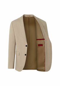 Beige Blazer mit einreihigem Design, schwarzen Knöpfen und einem hellbraunen Innenfutter, das einen roten Akzent in der Tasche hat.