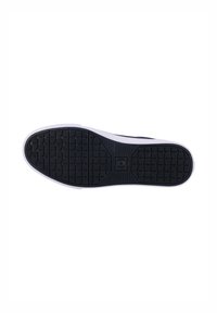 Black rubber sole with textured grip pattern and white midsole accents. Smooth edges and rounded toe design.