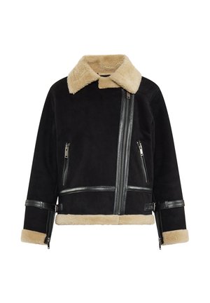 Zwarte schapenvachtjas met beige bontkraag en -manchetten, voorzien van een diagonale rits, zijzakken met ritsen en leren accenten.
