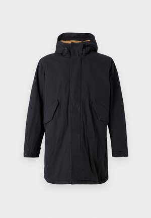 Svart parka-jacka med huva, som har dragkedja och knappstängning, två framfickor och en mjuk inre foder. Ren, rakskuren design.