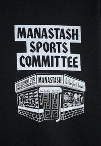 Black fabric featuring white graphic text and imagery of a corner sports store labeled "MANASTASH SPORTS COMMITTEE" with detailed window displays.