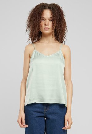 Light green satin sleeveless top with a V-neck design, thin adjustable straps, and a flowing silhouette. The fabric has a smooth, glossy texture.
