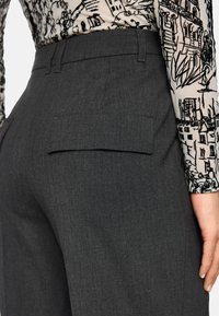Gray tailored trousers with a smooth texture, featuring a rear pocket and a high waist design. The fabric has a subtle woven pattern.