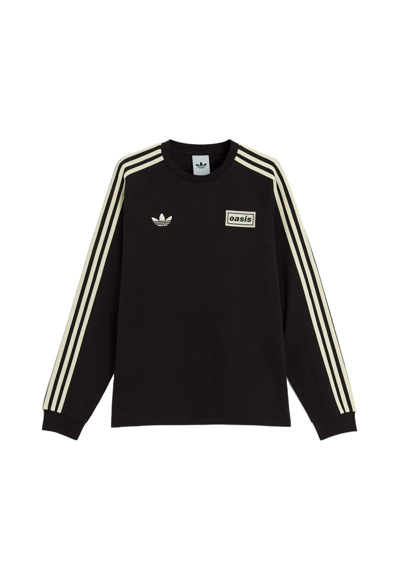 Black sweatshirt with long sleeves, cream stripes along the shoulders, and a rectangular "oasis" label on the front. Features a logo on the chest.