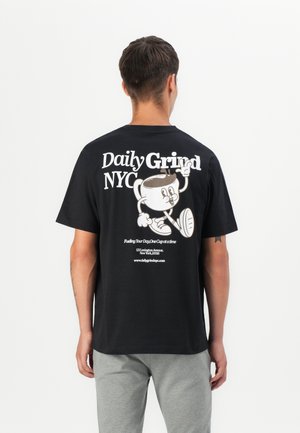 Black cotton t-shirt featuring a cartoon coffee cup graphic on the back, with white text "Daily Grind NYC" and website details.