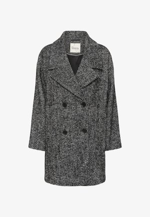 Double-breasted coat in a black and white herringbone pattern, featuring a notched collar and oversized fit. Buttons and flat pockets included.