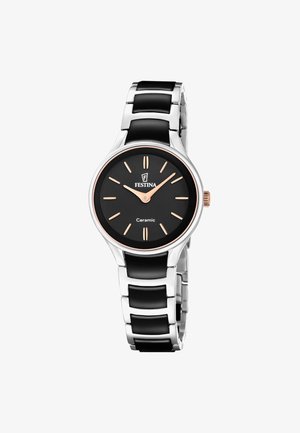 Festina zapestna ura s črnim keramičnim številčnikom in ohišjem v srebrni barvi, rožnato zlati kazalci in oznakami ter zapestnico iz kovine s črnimi keramičnimi dodatki.