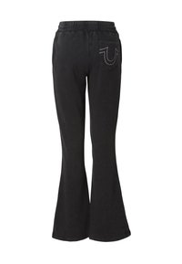 Czarne rozszerzane spodnie dresowe z elastycznym pasem, tylną kieszenią oraz kontrastującym białym przeszyciem na kieszeni. Miękka tekstura.