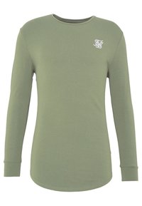 Langarmshirt in hellolivgrün, aus weichem Stoff, mit einem Rundhalsausschnitt und kleinem weißen Logo auf der Brust. Abgerundeter Saum.