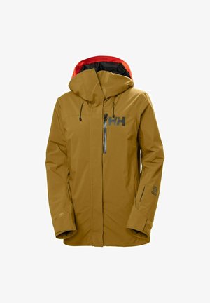 Geelbruin waterdichte jas met een rode binnenkap. Bevat een voorzak met rits, een verstelbare kap en gestikte accenten.
