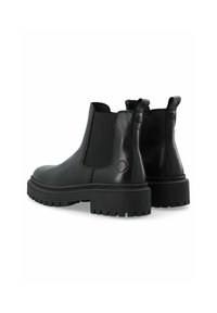 Botas Chelsea de cuero negro con paneles laterales elásticos, lengüetas y suelas de goma gruesas con un patrón de relieve robusto.