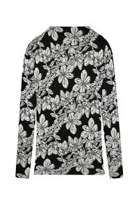 Long-sleeve black top with a white floral print, featuring large stylized flowers and leaves, soft texture, and a crew neck design.