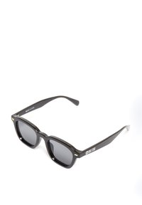 Mustad mustadrigade mustadre, halli toonikesed läätsed ja kuldne riistvara aktsendid käepidemetel. Brändi nimi "BIG STAR" on näidatud.