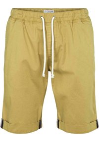 Szorty khaki wykonane z bawełny, z elastycznym pasem w białym kolorze i sznurkiem, z szerokimi mankietami oraz kontrastującymi paskami przy dolnej krawędzi.