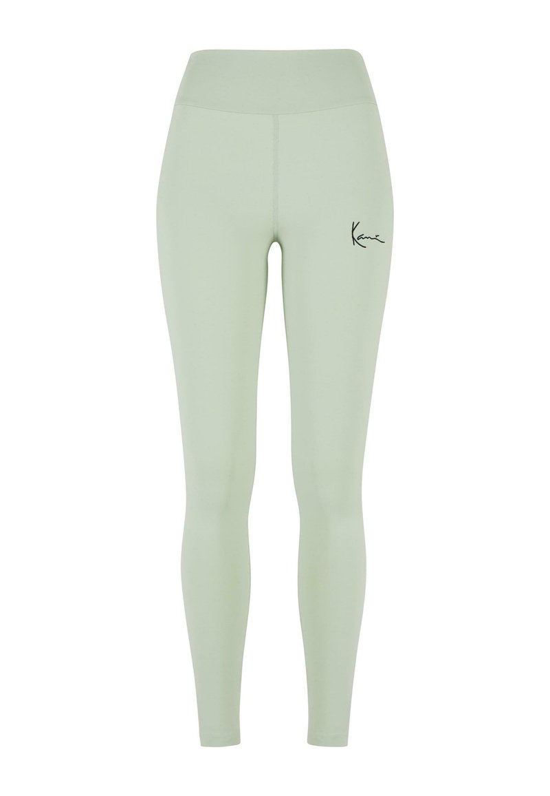 Leggings vert clair avec taille haute, fabriqués en matière extensible. Équipés d'un logo noir sur la cuisse gauche. Texture lisse, design pleine longueur.