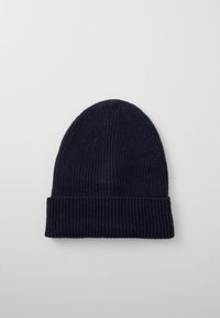 Navy knit beanie with a ribbed texture and a folded cuff. Made from soft material, it has a snug, rounded top without embellishments.