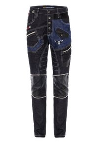 Jeans mit einer Mischung aus dunkelblauen und schwarzen Materialien, dekorativen Nähten, mehreren Taschen und Lederakzenten an den Knien.