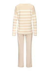 Beige long-sleeve top with white horizontal stripes, paired with matching beige pants. Soft fabric, relaxed fit, and crew neckline.