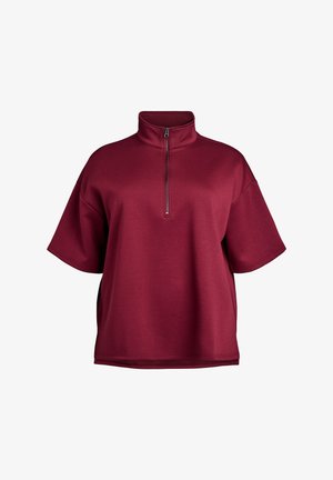 Burgundowy pulower pół-zamek z krótkimi rękawami, wykonany z miękkiego materiału, z kołnierzykiem typu stójka i eleganckim detalem zamka.