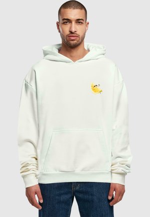 White hoodie made of soft fabric, featuring a front pocket and a small embroidered lemon design on the left chest.