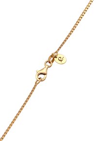 Guldkæde armbånd med en lobster clasp og en lille rund charme med et symbol. Leddene er tynde og jævnt fordelt.