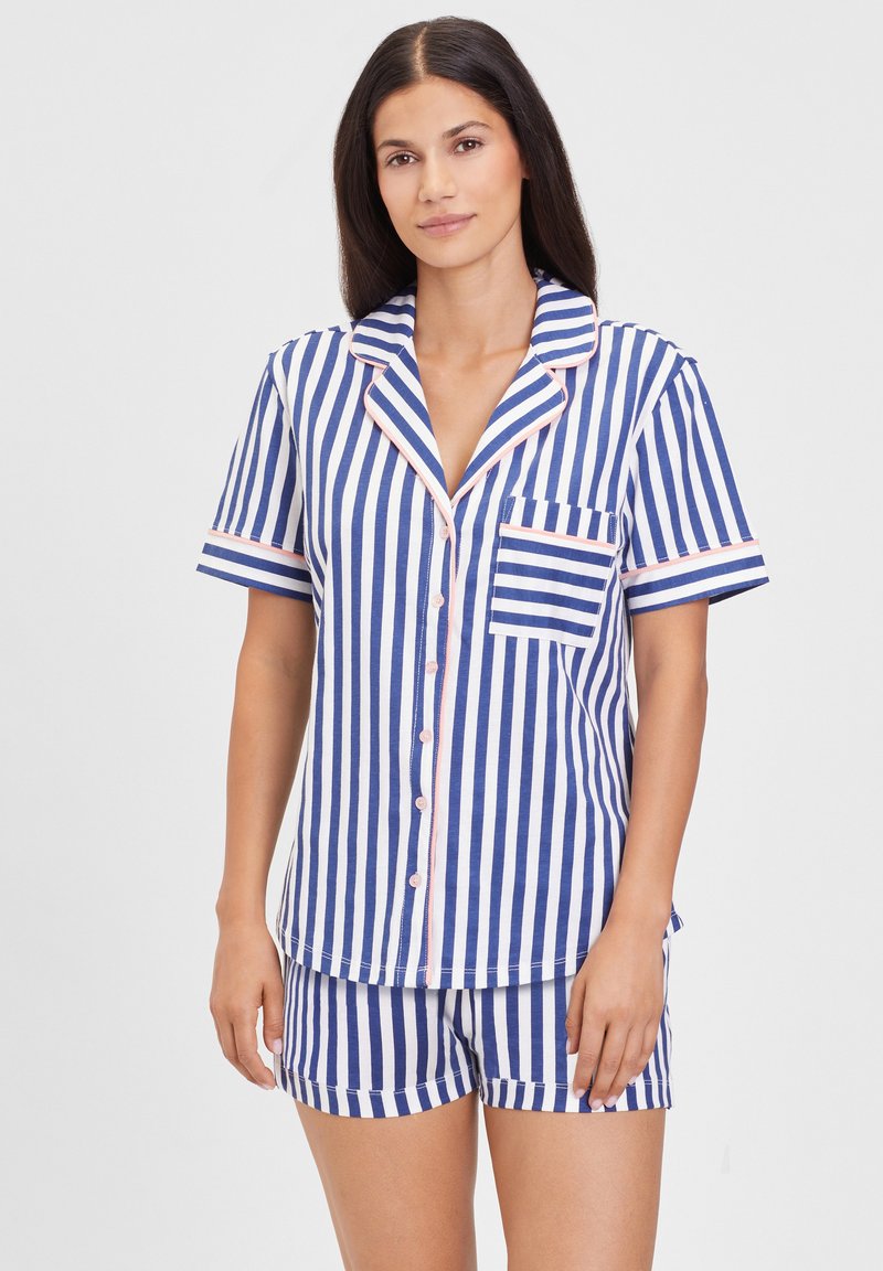 Cotton pajamas set featuring blue and white vertical stripes, short sleeves, and a chest pocket. Pink trim along the collar and sleeves.