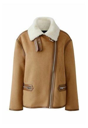Brown shearling jacket with a white fur collar, side zip pockets, and leather accents. Features a front zipper closure and a boxy silhouette.