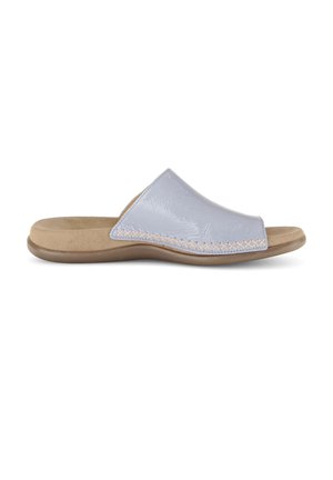 Light blue slide sandal with cushioned beige footbed, brown sole, and visible cross-stitch detail along the edge of the upper strap.