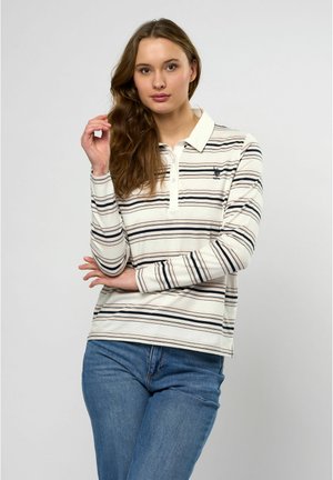 Langärmliges Poloshirt in Creme mit navyblauen Streifen, mit einem spitzen Kragen und einem kleinen Logo auf der linken Brust. Strukturierter Baumwollstoff.