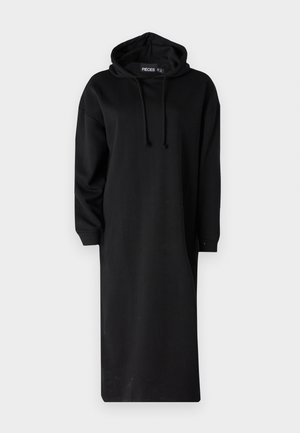 Juoda gobtuvinė suknelė, pagaminta iš medvilnės mišinio. Su ilgomis rankovėmis, kengūrų kišene ir reguliuojamu gobtuvu. Paprastas, tiesus siluetas.