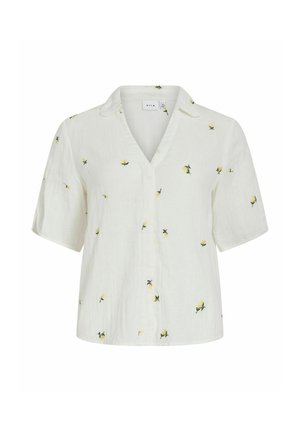 Chemise blanche à manches courtes avec col et boutons, ornée de petites fleurs jaunes dispersées sur le tissu.