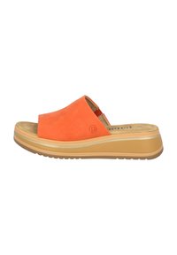 Mules en suède orange avec une épaisse semelle de plate-forme beige, dotées d'un bout rond et d'un discret logo sur le côté.