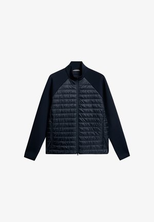 Navy zip-up jacket with a quilted front and solid sleeves, featuring a stand collar and zippered pockets on both sides.