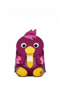 Child's backpack shaped like a purple bird with large eyes, yellow beak, pink wings, and yellow feet, featuring a name tag on the front.