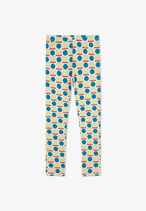 Leggings de tela ligera con un colorido patrón geométrico que incluye círculos azules y cuadrados amarillos sobre un fondo blanco.